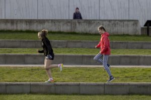 Two young people running