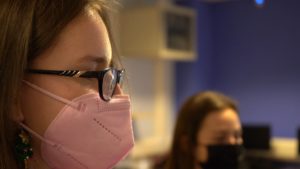 Young person in classroom wearing facemask