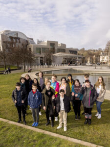 Group of young people standing in front of the Scottish Parliament. Picture: Alan Rennie