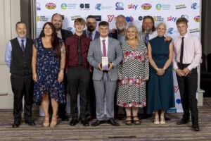 Group shot of TD1 Youth Hub after winning their national youth work award.