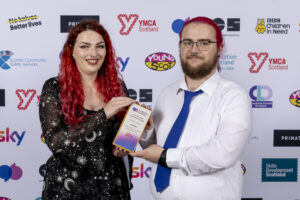 Press shot of Digital & STEM winners at the National Youth Work Awards showing off their trophy.