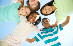 Group of young people with arms around each other