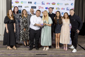 PEEK youth work team hold their Inclusion & Prevention trophy at the national youth work awards. Press shot.