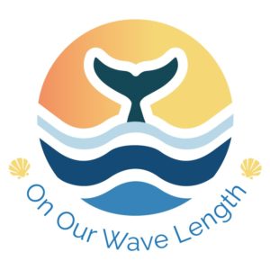On Our Wave Length logo, image of whales tail in water