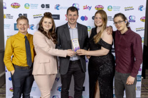 National Youth Work Awards winners Dead Action pose with their Team of the Year trophy