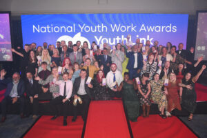 Group photo on stage of all the national youth work awards winners.
